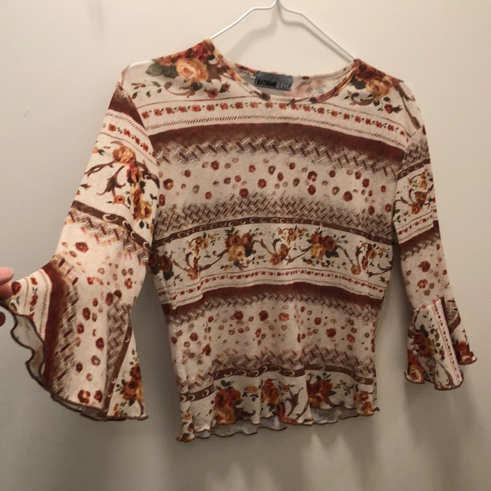 Jean Paul Gaultier style sheer top with cute sleeve detail and lettuce edges